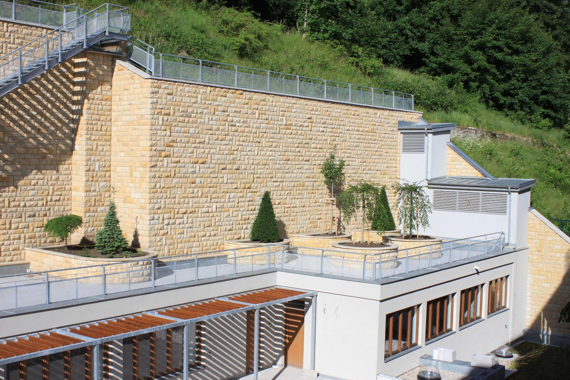 Luxury Spa Hotel Olympic Palace Karlovy Vary Exterior photo A retaining wall made of concrete